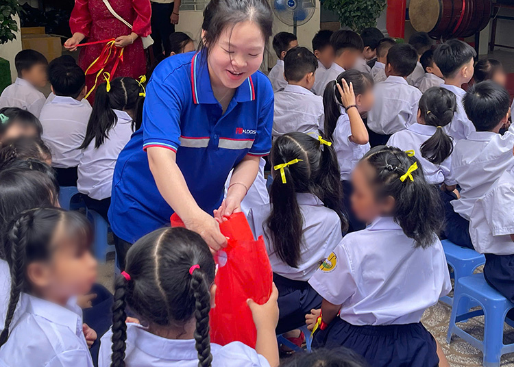 Handing out school kits and uniforms to 230 pupils